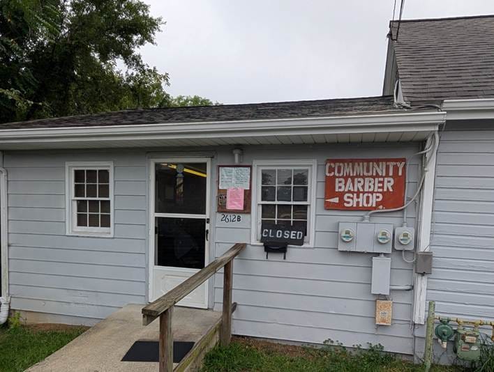 The longtime home of Community Barber Shop at 2612B Cove Road NW. The shop moved into this location in 1980 and remained there until its closing in September 2026.
