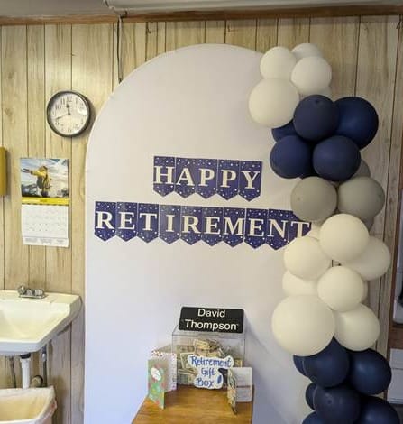 A retirement display for George “David” Thompson inside Community Barber Shop marked the end of a 61-year barbering career and the closing of a neighborhood institution.
