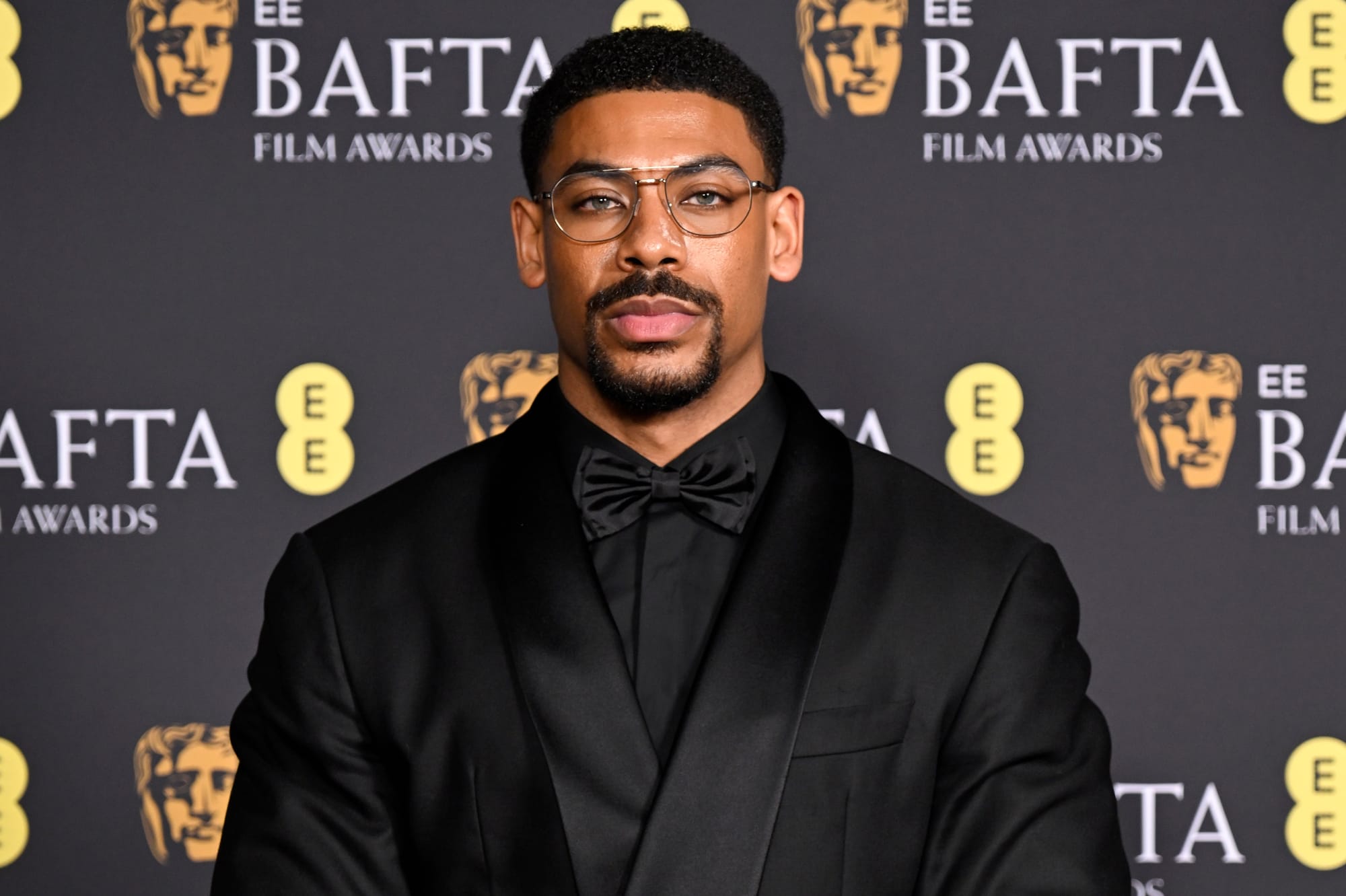 LONDON, ENGLAND - FEBRUARY 22: Aaron Pierre poses in the winners room during the 2026 EE BAFTA Film Awards at The Royal Festival Hall on February 22, 2026 in London, England. (Photo by Gareth Cattermole/Getty Images)