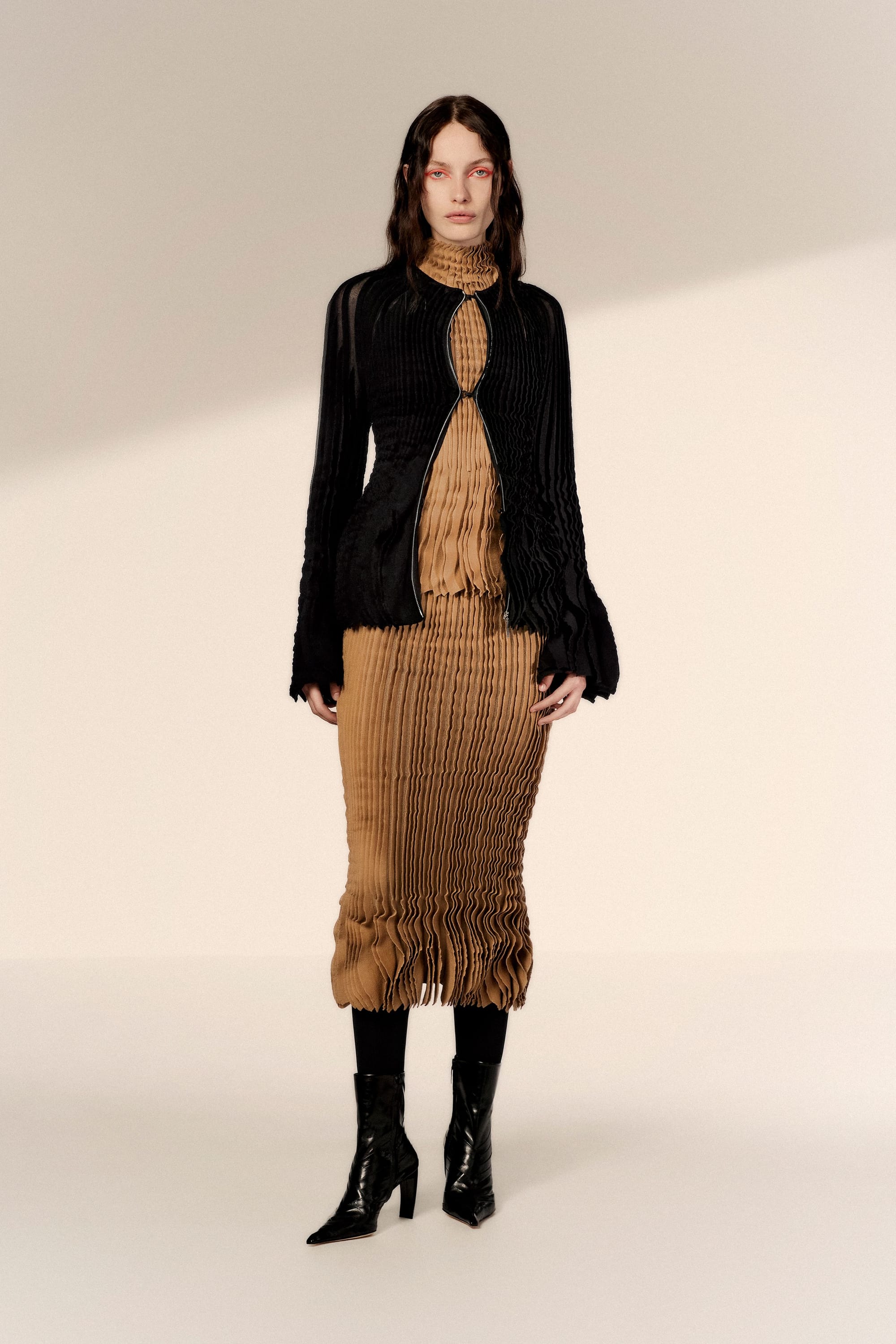 Image may contain Mona Johannesson Clothing Long Sleeve Sleeve Blouse Adult Person Coat Fashion Dress and Knitwear