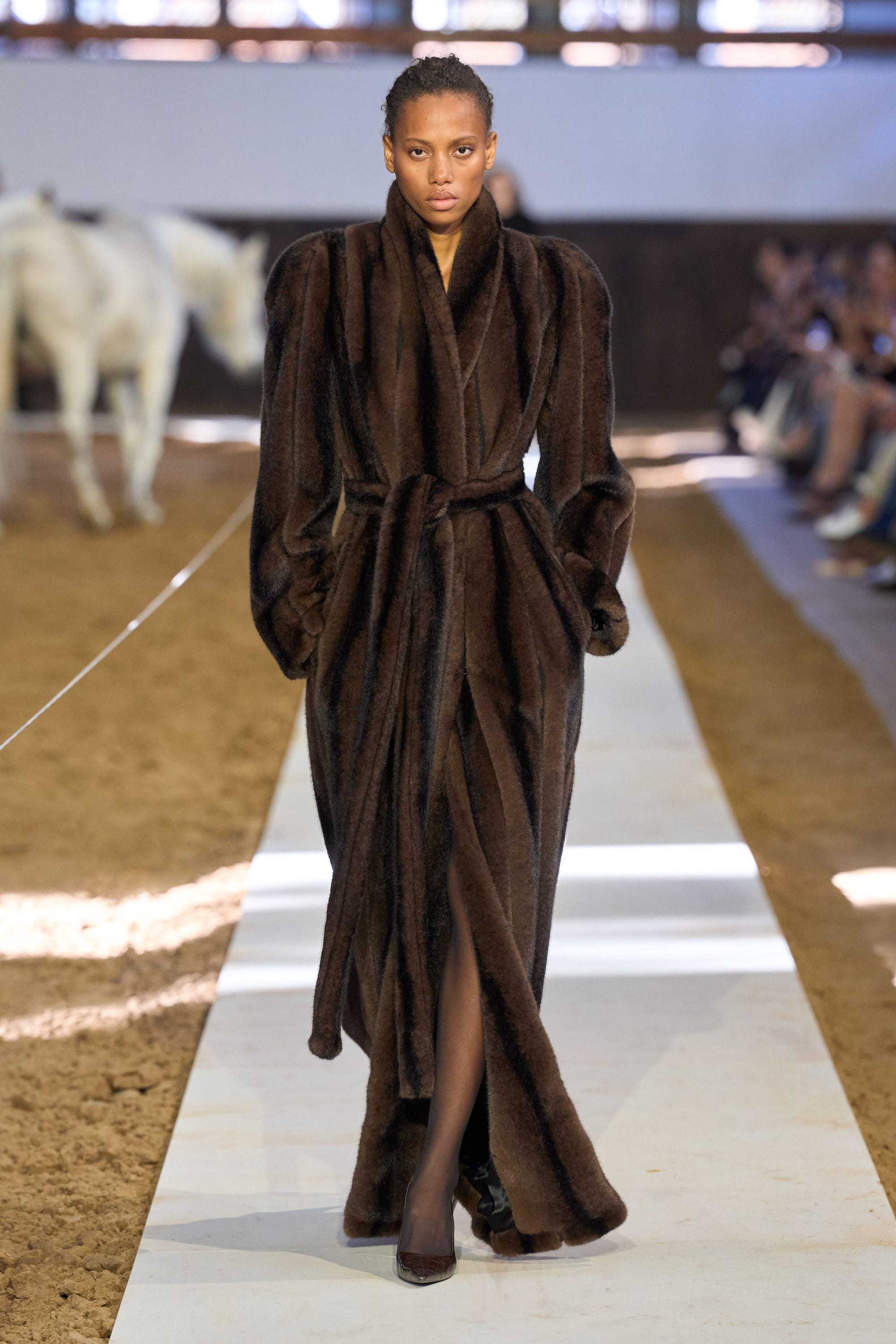 Image may contain Fashion Clothing Robe Adult Person Coat Animal Horse and Mammal