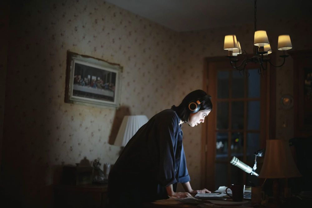 A still from Undertone showing the film's visual aesthetic—ideally something that demonstrates the intersection of internet horror's rough energy and classical filmmaking's precision. Alte...