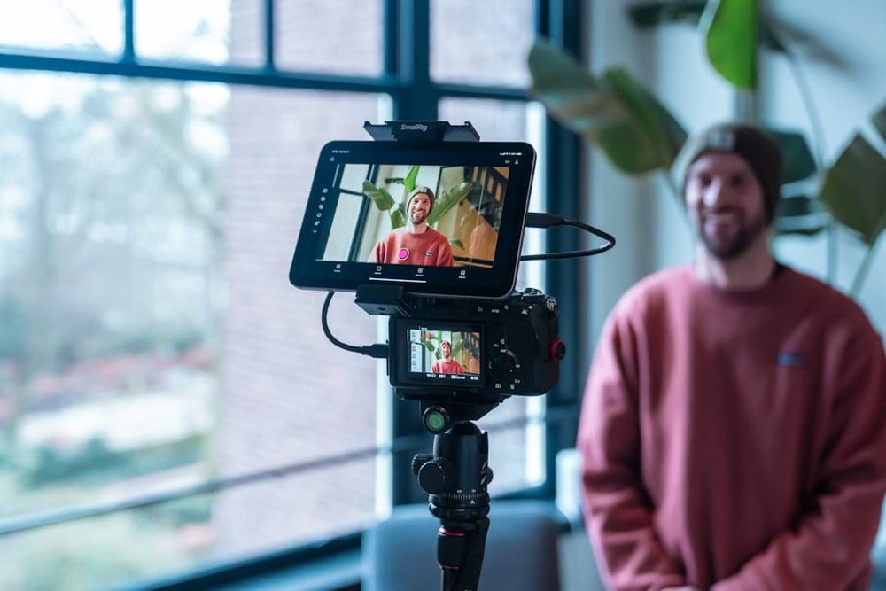 Content creator filming with a professional camera setup