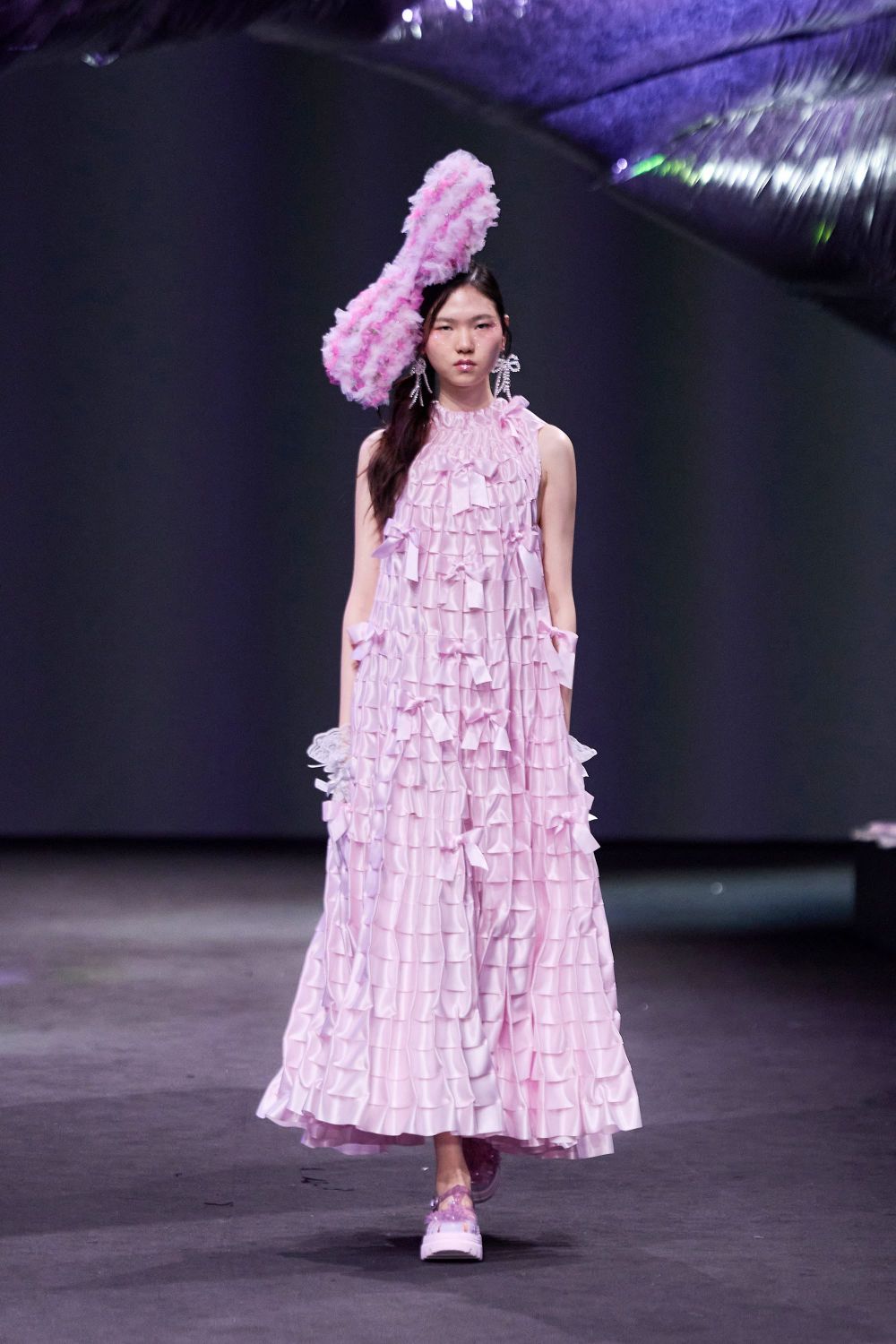A runway shot from Susan Fang's Fall 2026 Shanghai show featuring one of her signature inflatable or sculptural silhouettes—something that visually demonstrates the technical sophisticatio...