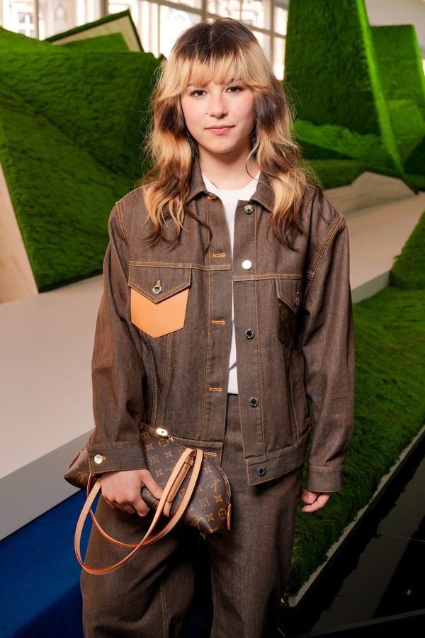 Alysa Liu seated front row at the Louis Vuitton Fall/Winter 2026 show during Paris Fashion Week, ideally showing her bleached blonde hair and wearing Louis Vuitton designs, capturing the m...