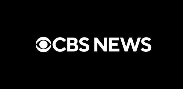 Photos from the walkout at CBS News Broadcast Center in Manhattan or KPIX in San Francisco showing WGAE members on the picket line with union signs, or a wide shot of the CBS News building...