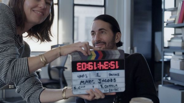 Archival photograph of Marc Jacobs and Sofia Coppola together in 90s New York—ideally from the grunge collection era or from a downtown NYC event. Should feel candid and unpolished, captur...