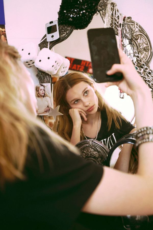 Abstract or editorial illustration showing algorithmic recommendation systems as a designed architecture — not neutral infrastructure. Visual metaphor: infinite scroll as a trap, or recomm...