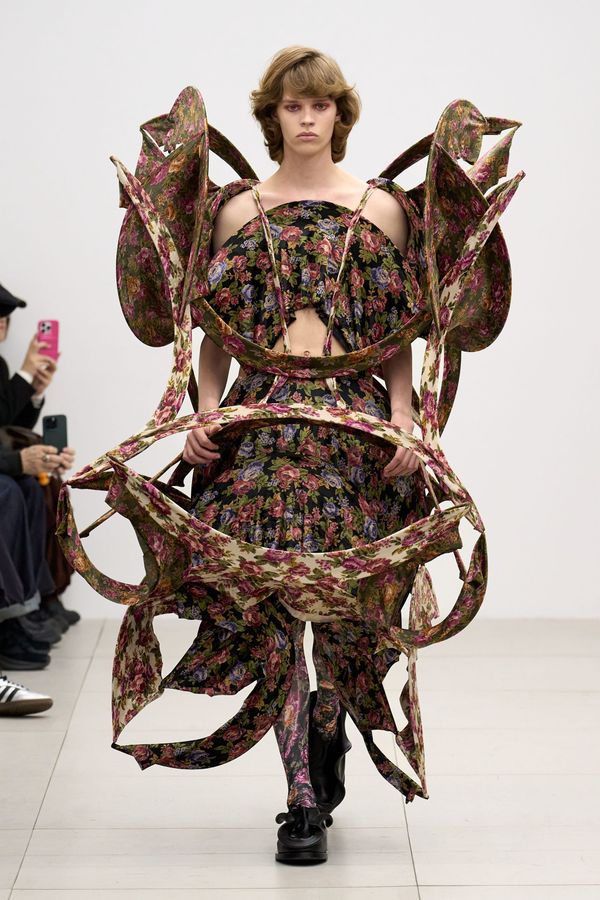 A look from Ryunosukeokazaki Fall 2026 showing the balance between architectural experimentation and wearability — structured outerwear with exaggerated proportions but clean, commercial l...