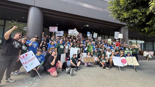 WGA West picket line from 2023 strike, or WGSU staff holding strike signs outside guild headquarters — visual contrast between external labor victory and internal labor dispute