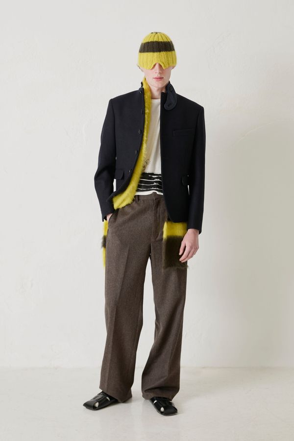 A runway image from Carlota Barrera's Fall 2026 Madrid show — ideally a full look that shows the tailoring and commercial wearability mentioned in the piece, with visible venue context tha...