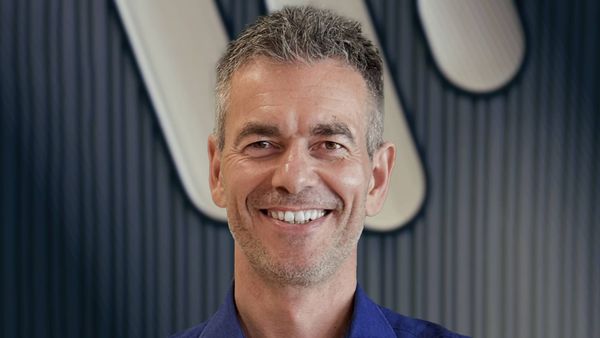 A conceptual image showing music distribution infrastructure—server racks, digital interfaces, or streaming platform dashboards—representing the backend technology Warner is acquiring. Alt...