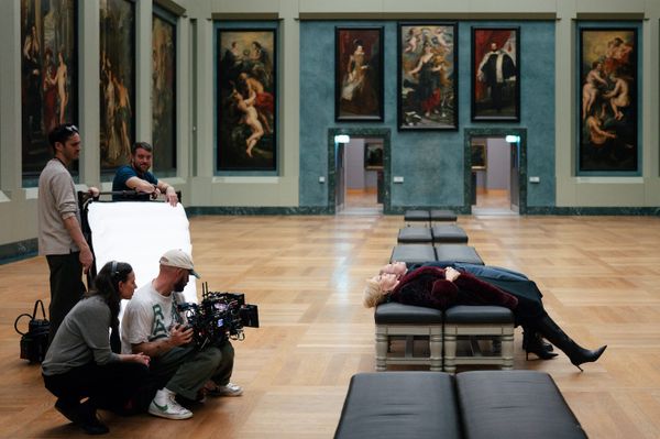 A still from the Hacks finale showing Jean Smart's Deborah Vance inside the Louvre, or an exterior shot of the museum that conveys its institutional weight