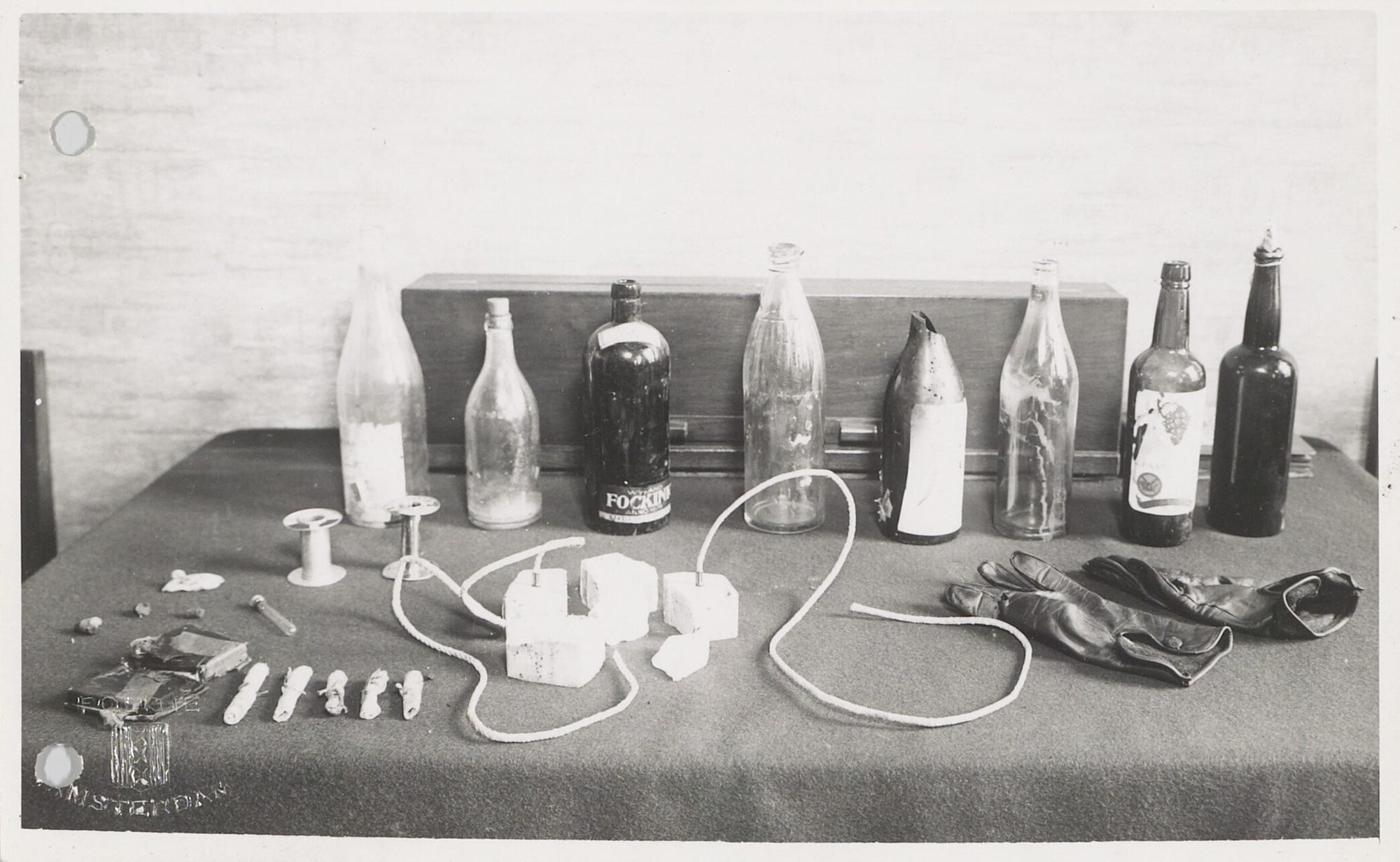 Photos of damage done the Amsterdam Bevolkingsregister (the population registry) and the improvised explosive devices used after being attacked by a group of resistance fighters led by Willem Arondéus. Courtesy Amsterdam Archief.