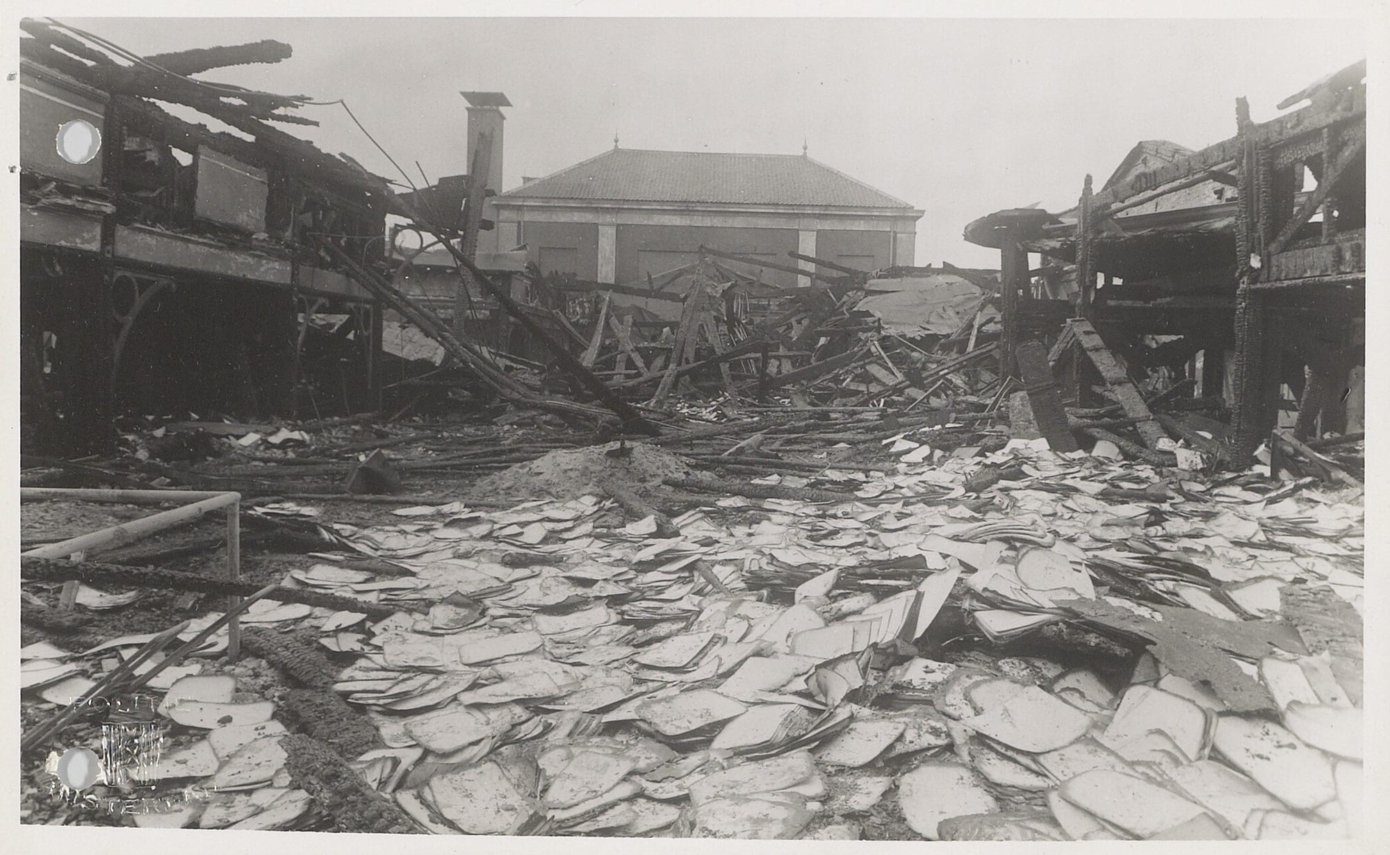 Photos of damage done the Amsterdam Bevolkingsregister (the population registry) and the improvised explosive devices used after being attacked by a group of resistance fighters led by Willem Arondéus. Courtesy Amsterdam Archief.