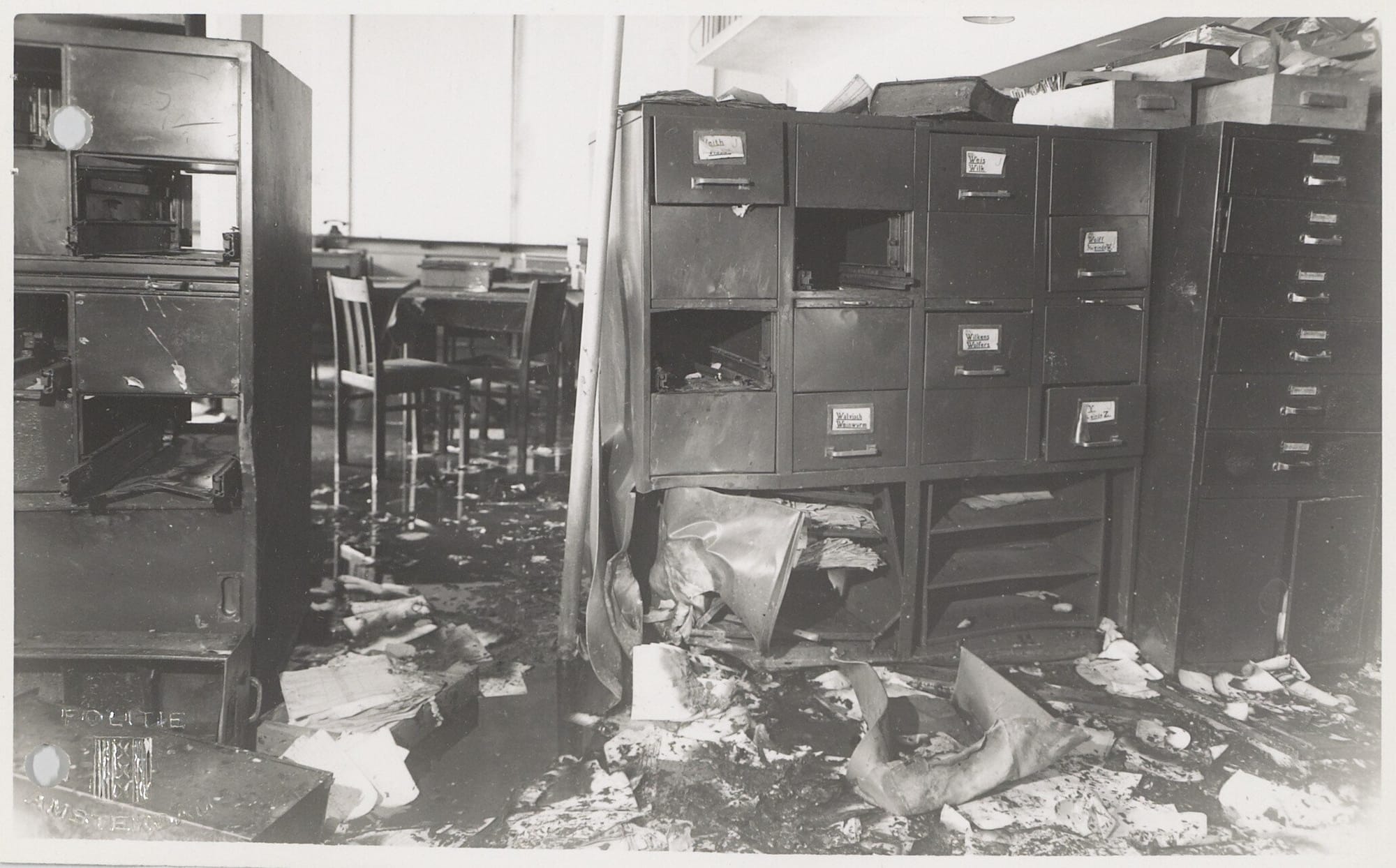 Photos of damage done the Amsterdam Bevolkingsregister (the population registry) and the improvised explosive devices used after being attacked by a group of resistance fighters led by Willem Arondéus. Courtesy Amsterdam Archief.