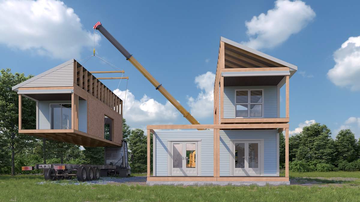 Assembling a modular house exterior.