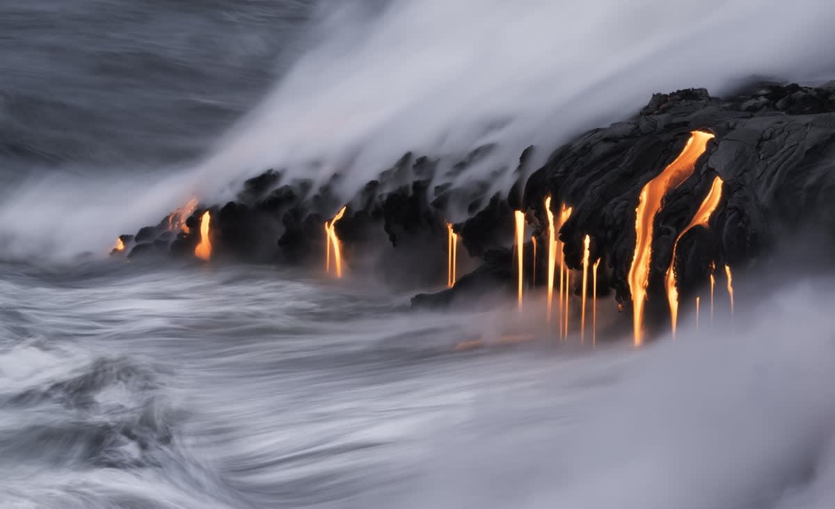 Lave flowing into the sea from Kilauea volcano in Hawaii