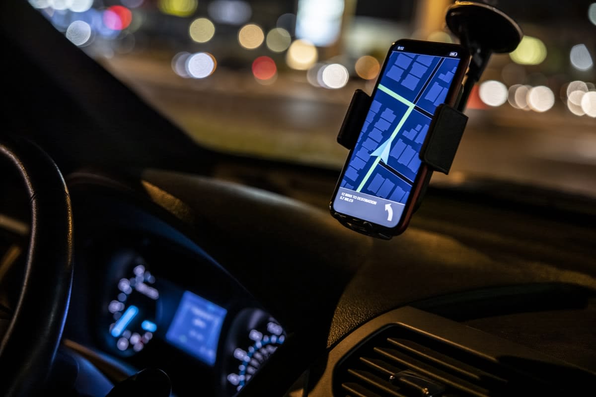 GPS showing on a mounted smartphone a a car at night 