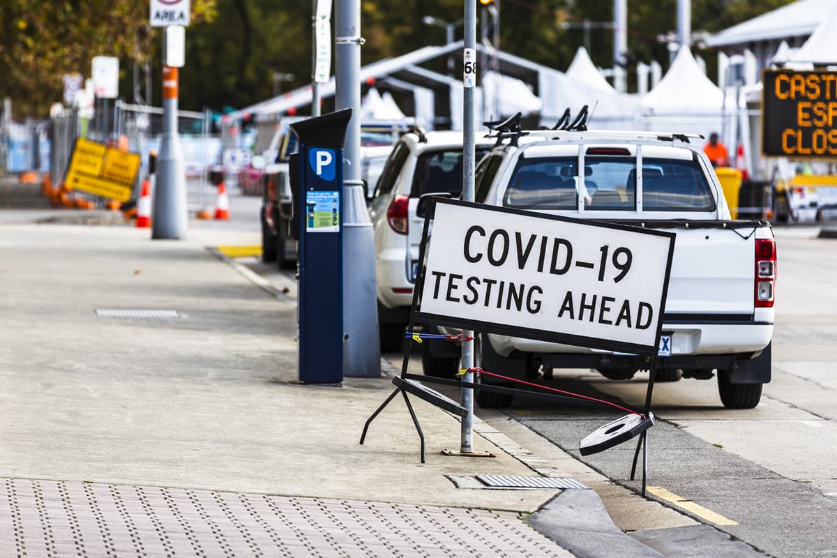 Picture of road with "COVID testing ahead" sign