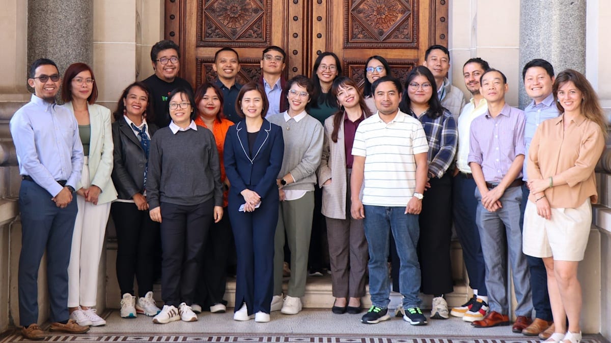 Trang Nguyen and&nbsp;the fellows from across Southeast Asia, part of the&nbsp;Australia Award Fellowship Program’s Southeast Asia Just Energy Transition, outside the Victorian Parliament.