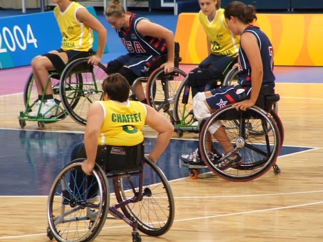 Action shot of Australia versus USA in an Olympic Games wheelchair basketball match in Athens in 2004