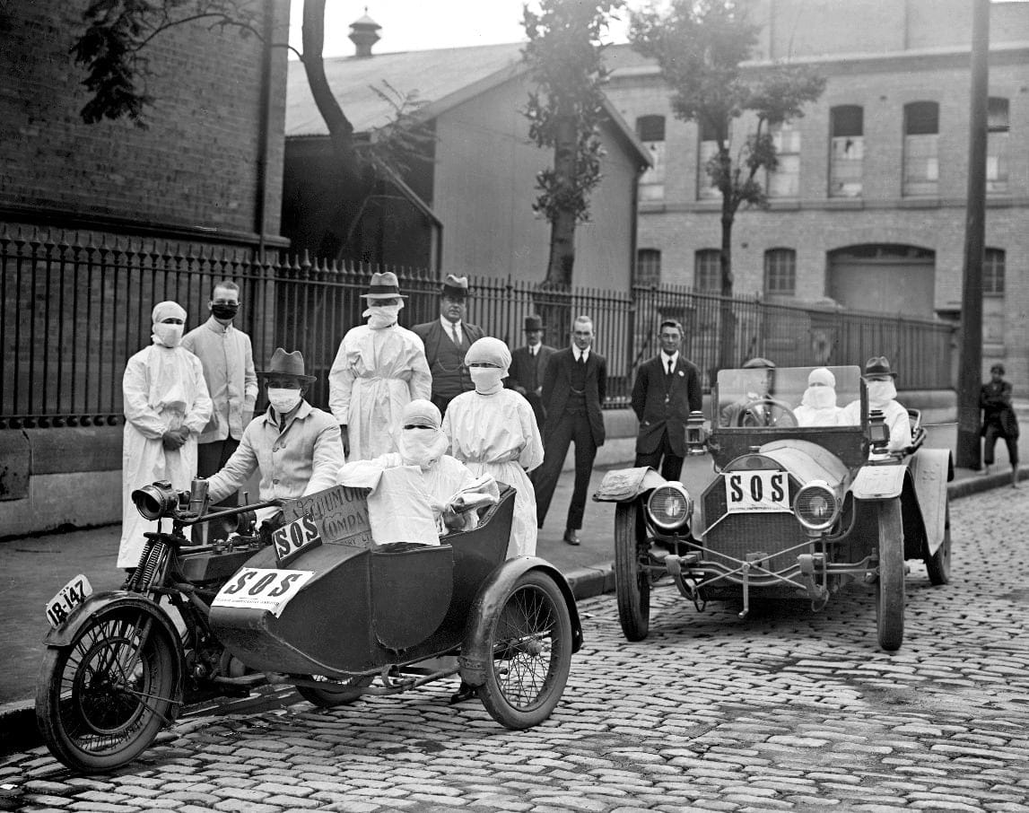 Medical staff in a car and motorcycle sidecar during the Spanish Flu pandemic in 1918 