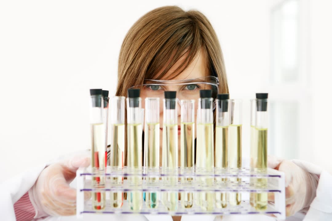 Woman researcher with test tubes