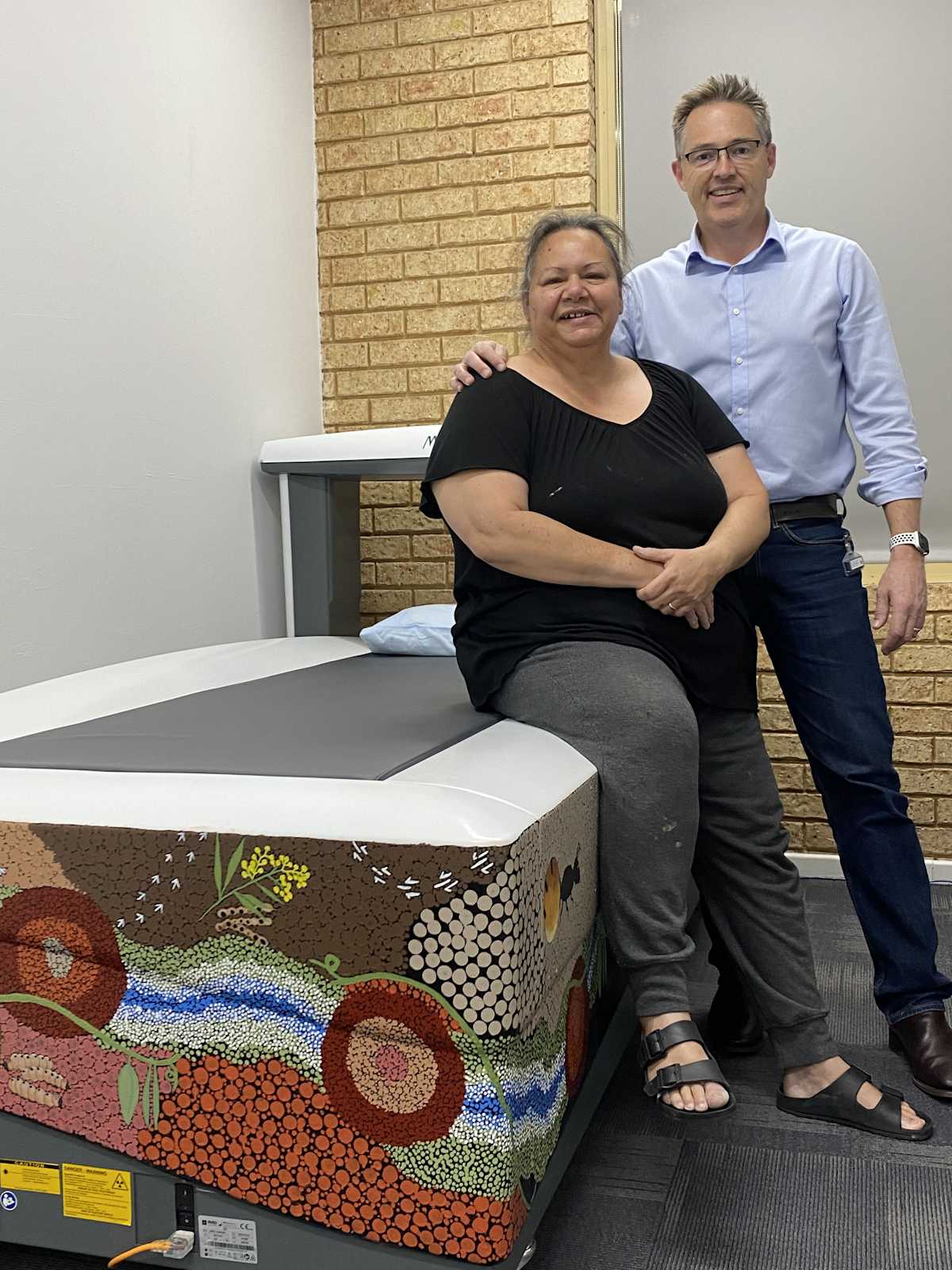 Artist Carol Thompson and Dr Pete Tually with the painted bone imaging scanner