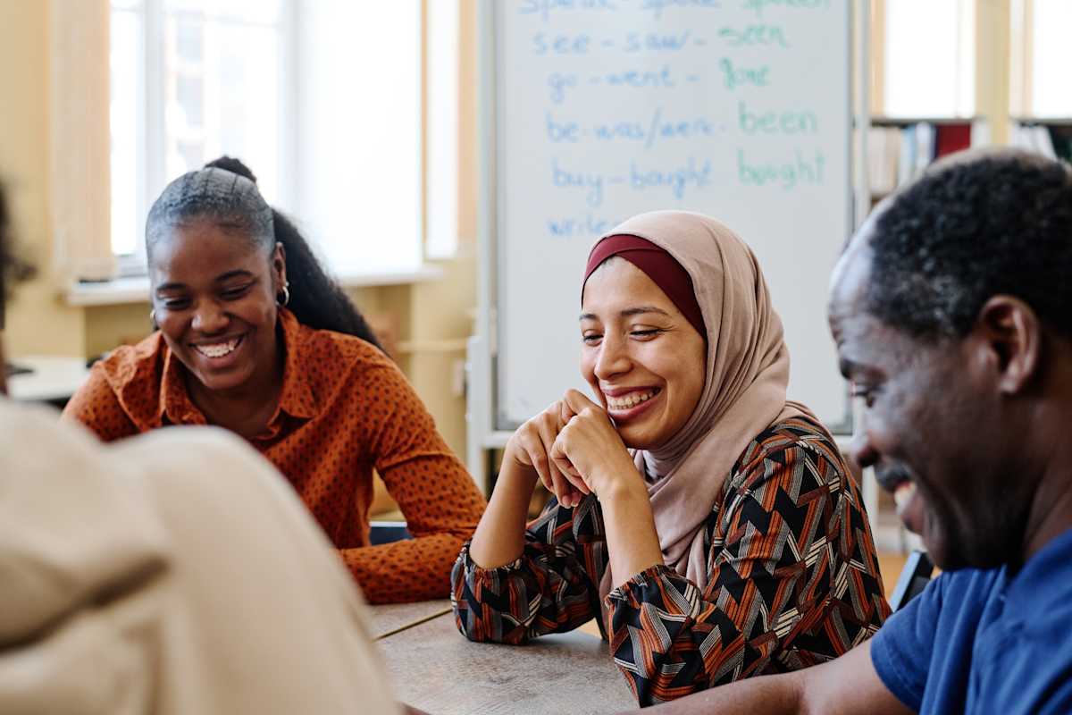 Multi-ethnic students sitting in a classroom.