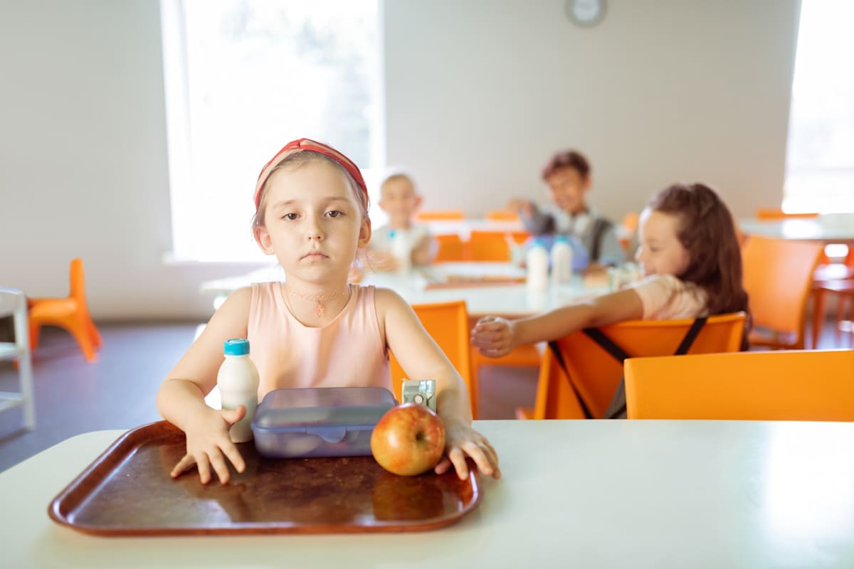 Girl sitting at the table alone