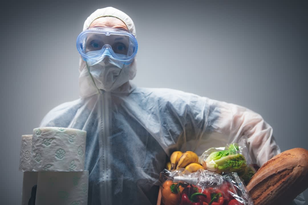 Woman shopping in protective clothing