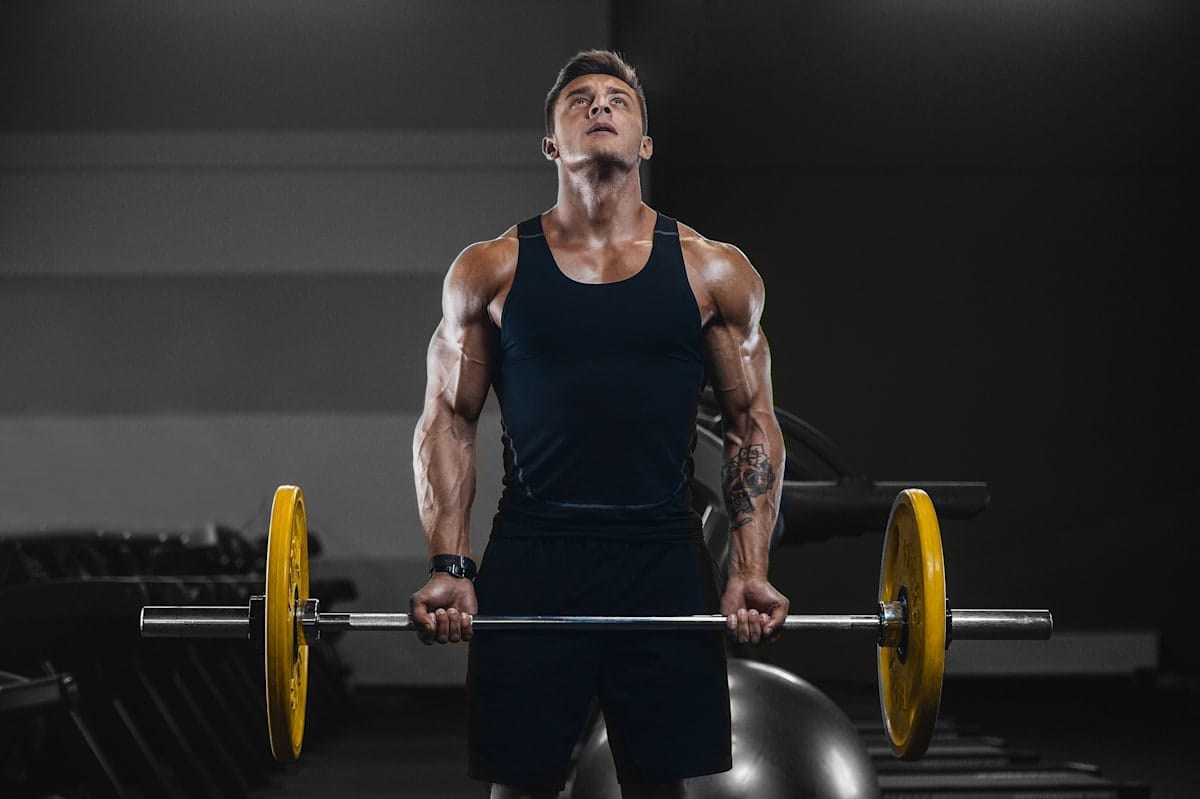 A fit and healthy man lifting weights.