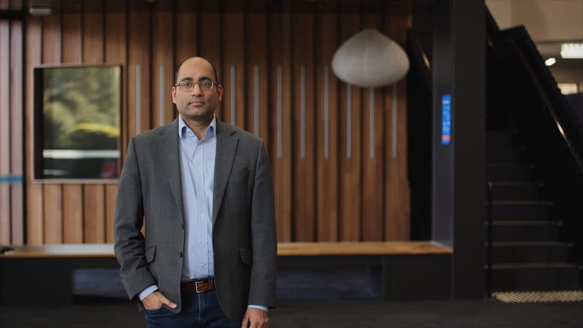 Front-on standing portrait of Associate Professor Adeel Razi