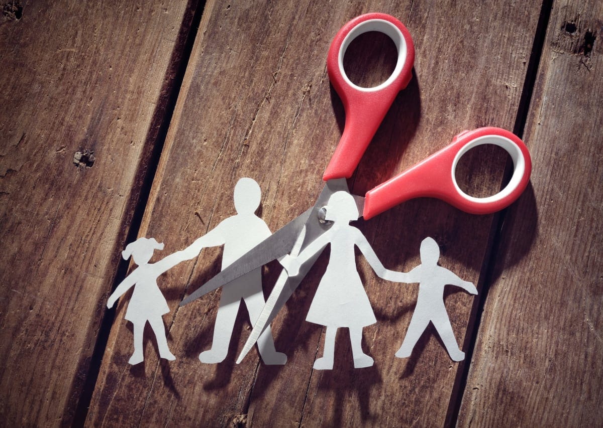 Divorce and child custody scissors cutting family apart