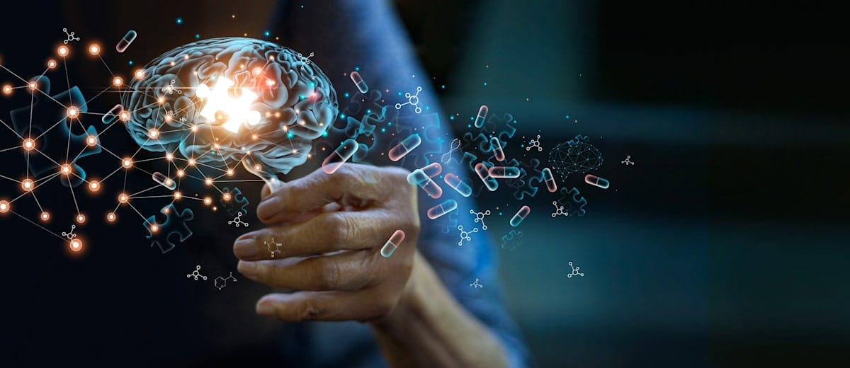 Human hand reaching out to a digital graphic brain with tablets in its wake