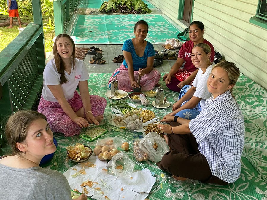 Gig students preparing  and enjoying a traditional Fijian meal