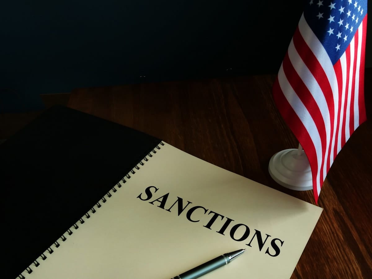 American sanctions and USA flag on table