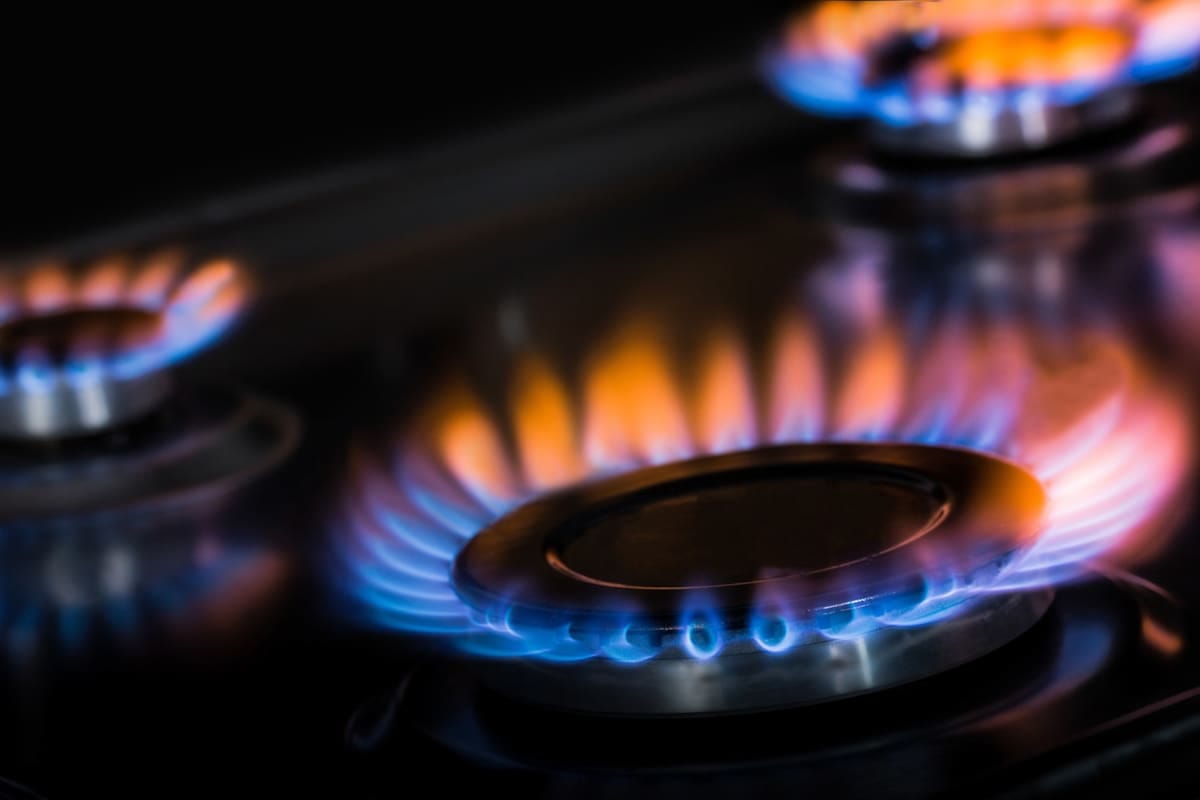 A gas burner on a stovetop