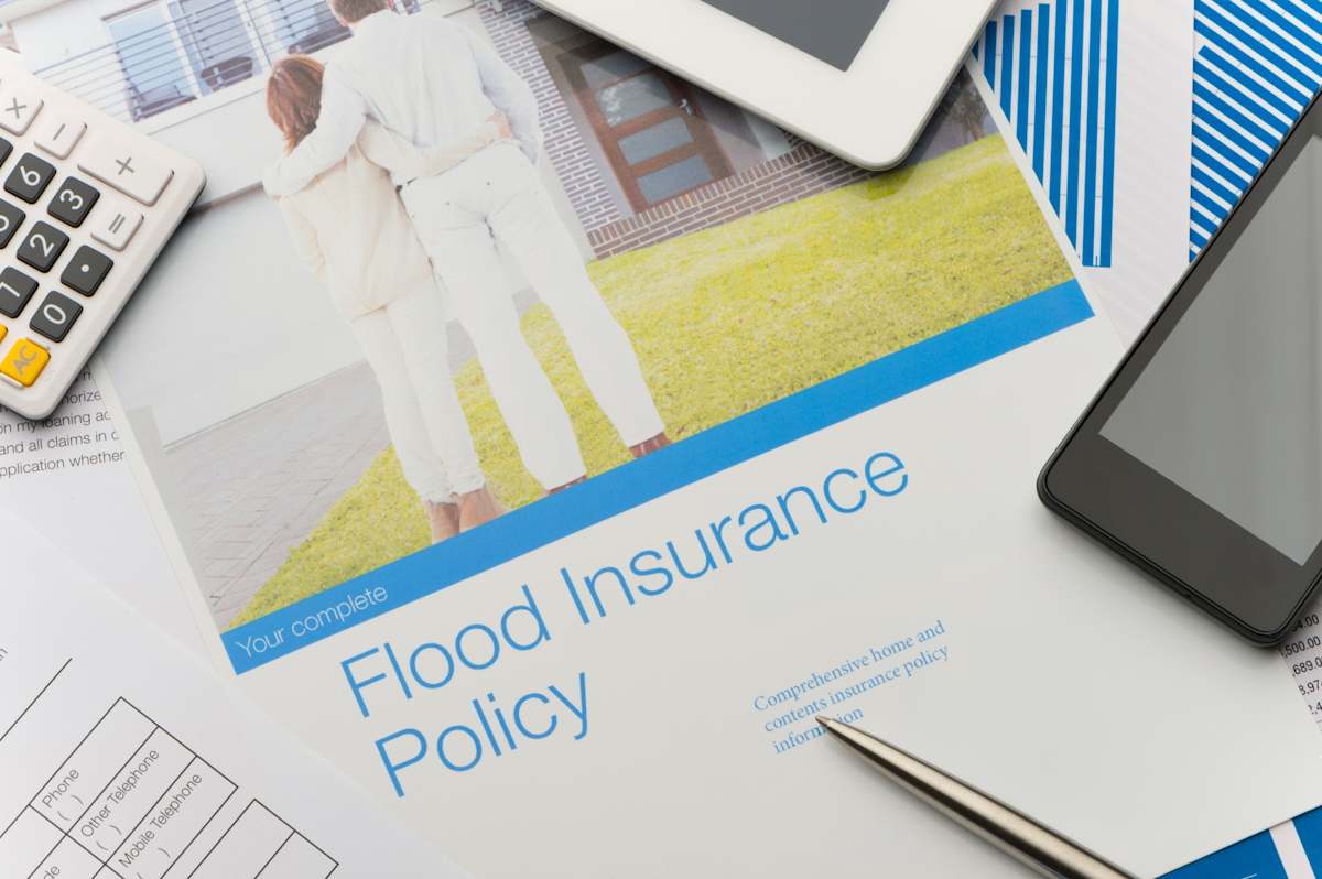 Flood insurance policy brochure with image of a couple
