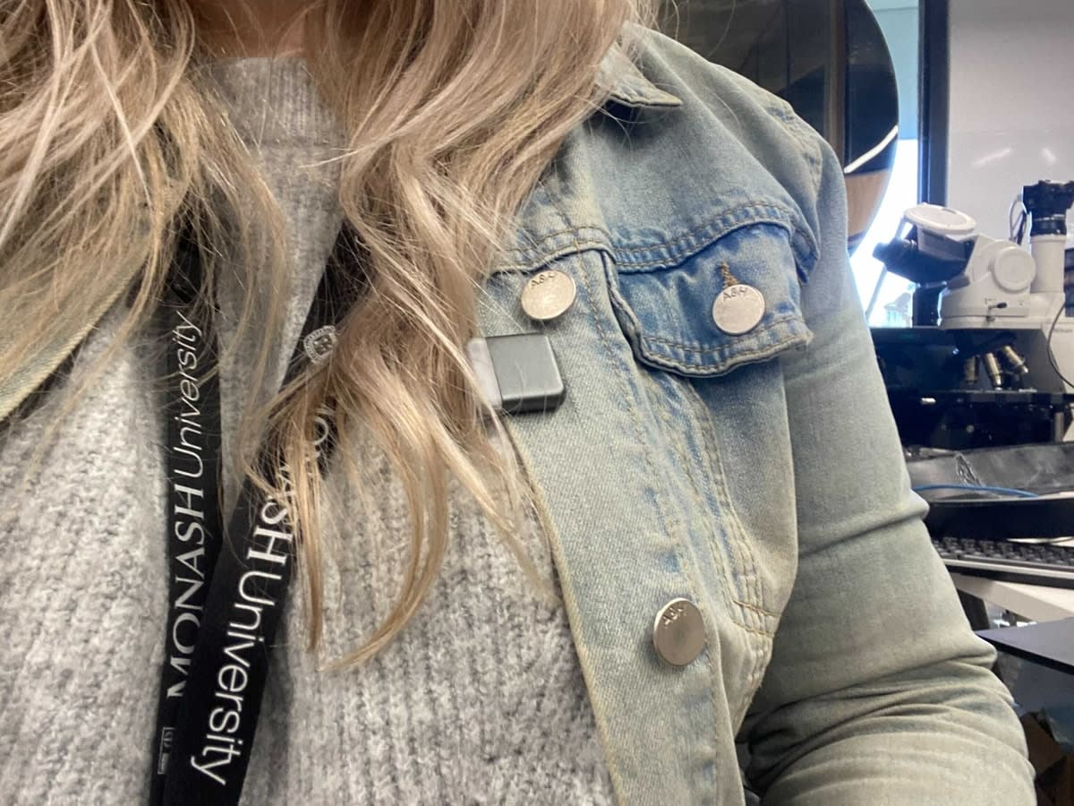 Close-up of the light sensor device attached to a woman