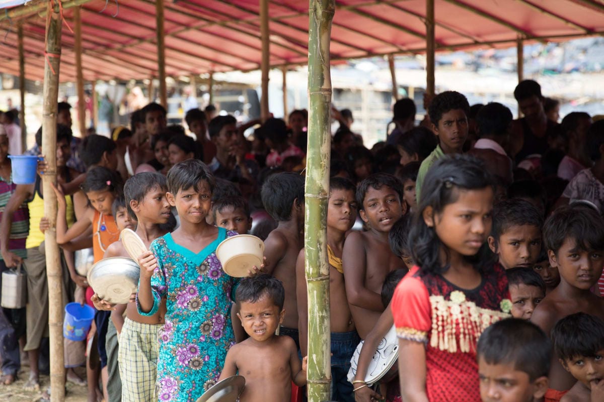 Rohingya children waiting for food in refugee camp in Bangladesh.