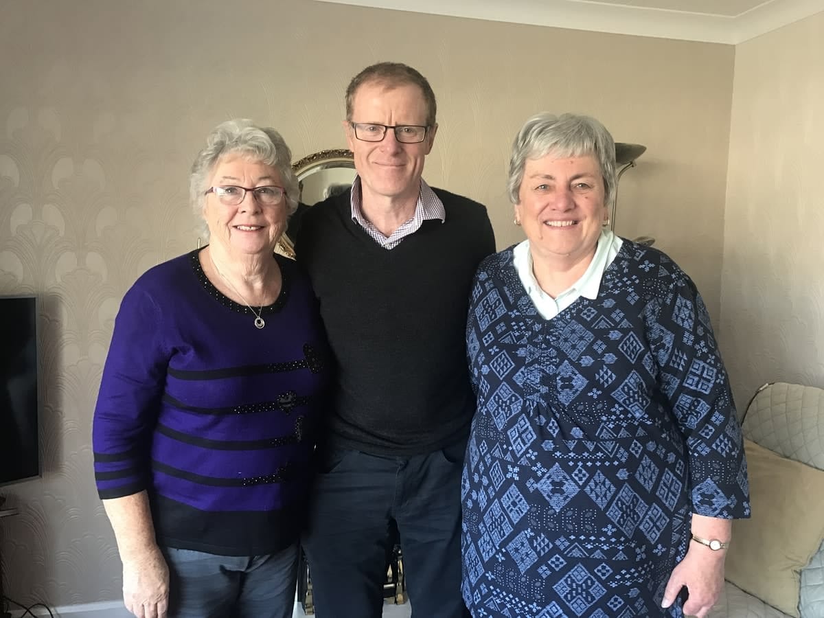 Jamie Rossjohn flanked by his now-elderly high school teachers, Mrs Griffiths and Mrs Thomas