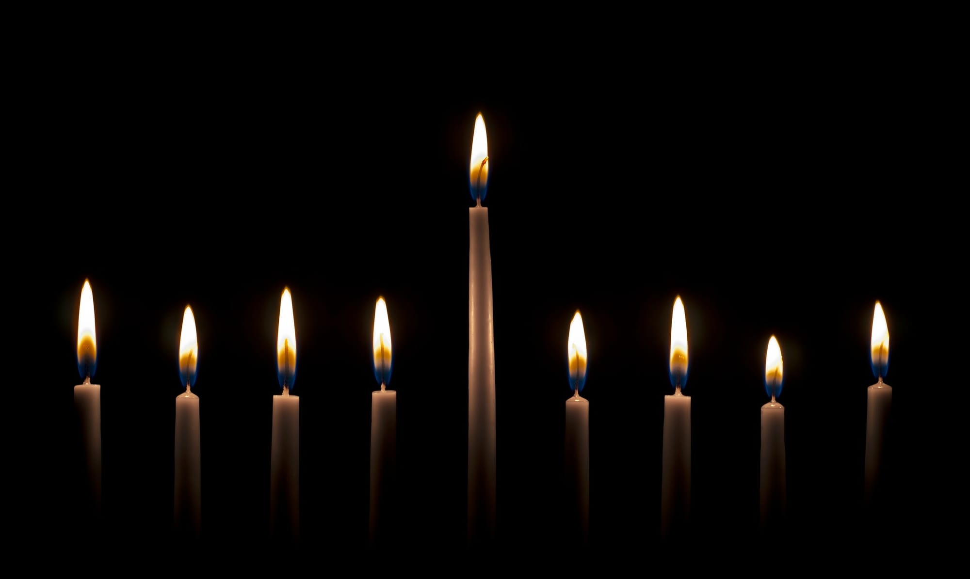 Menorah lit for Hanukkah celebration.