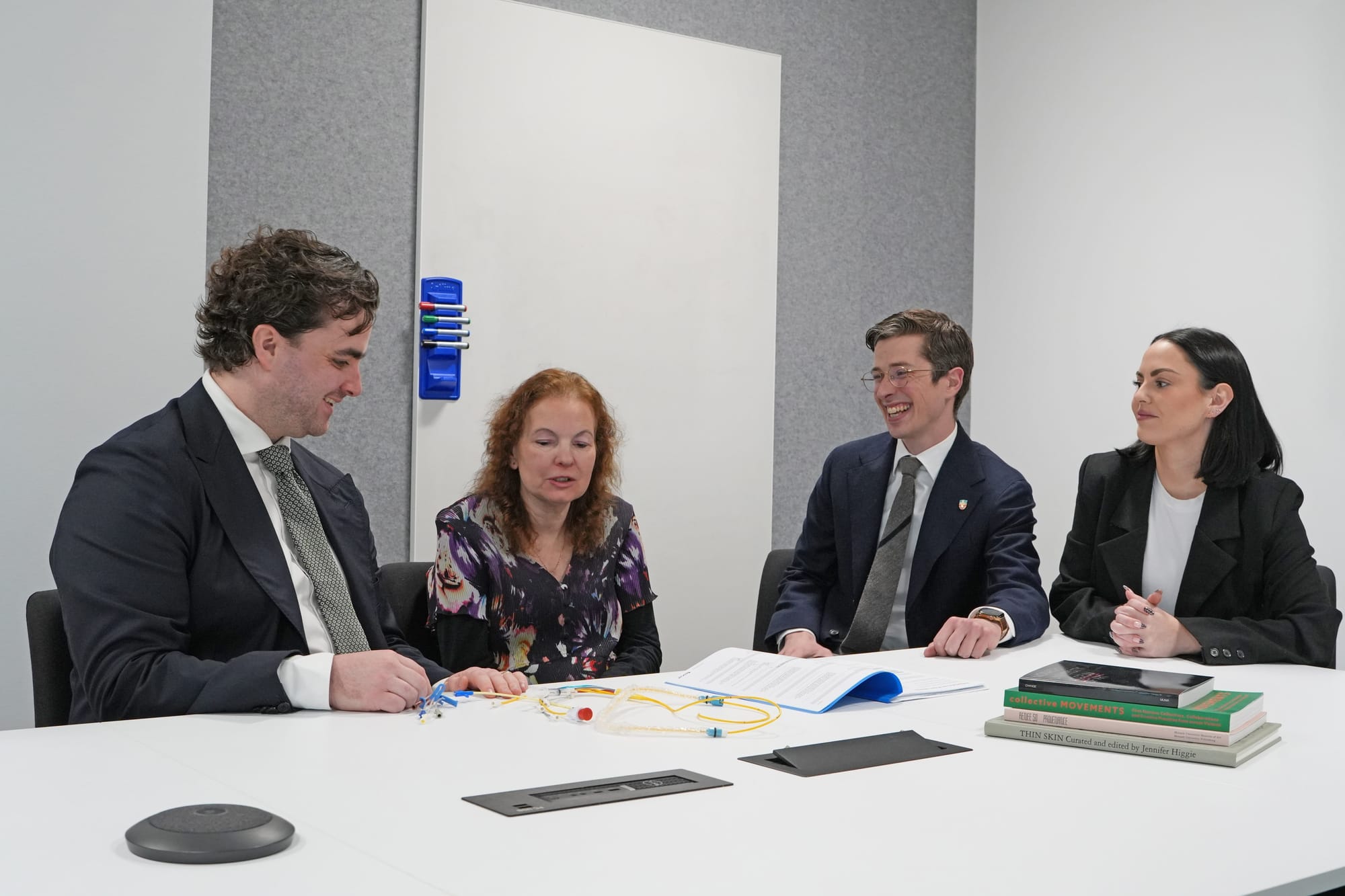 Dr Luke Perry, Anne Hosemans, Associate Professor Lachlan Miles and Paige Druce sitting at a table