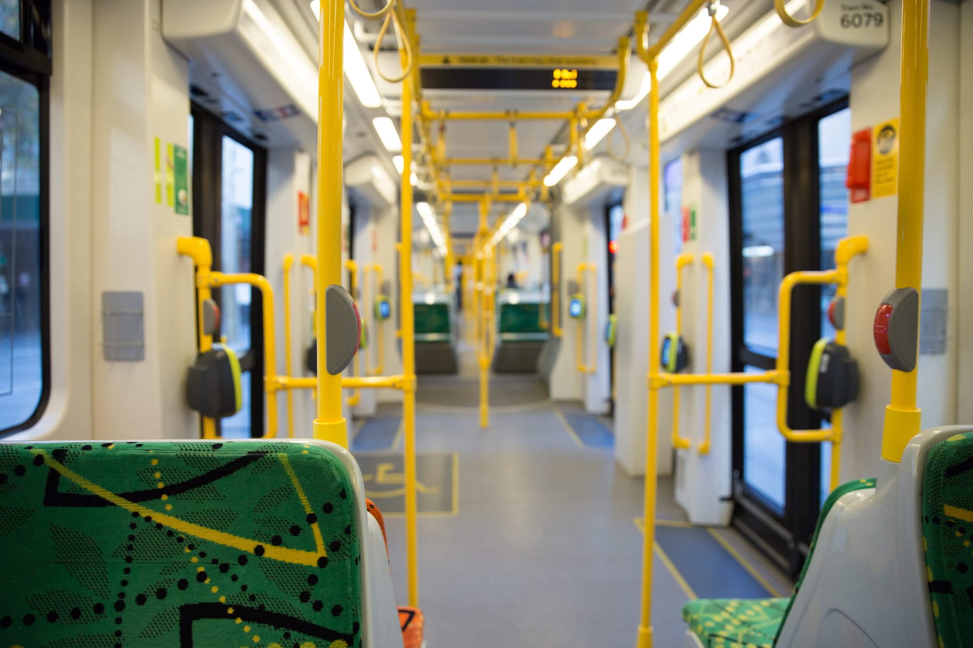 View looking down the interior of an empty tram 