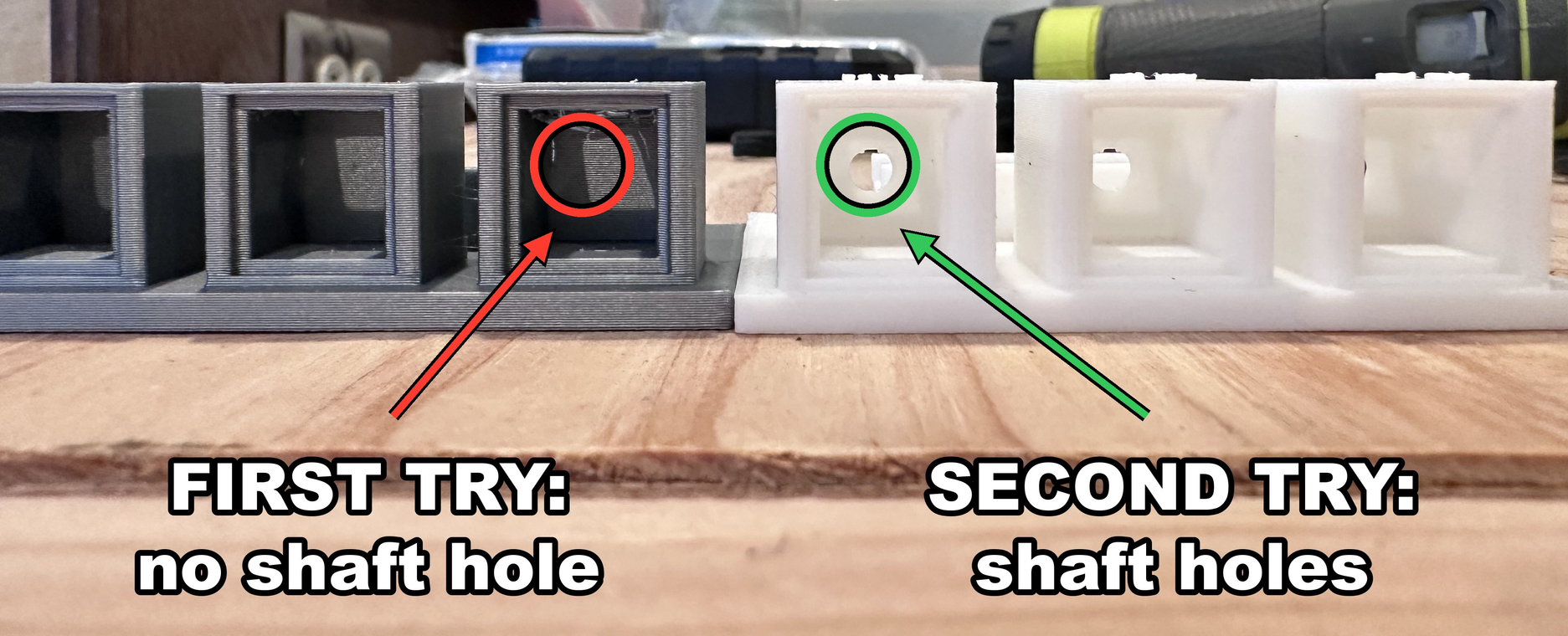 Two 3D-printed motor housings sit side by side on a workbench — a gray first attempt circled in red showing no shaft hole, and a white redesigned version circled in green showing a correctly included shaft hole, illustrating how Jaws had to reprint the test piece after omitting this critical feature.