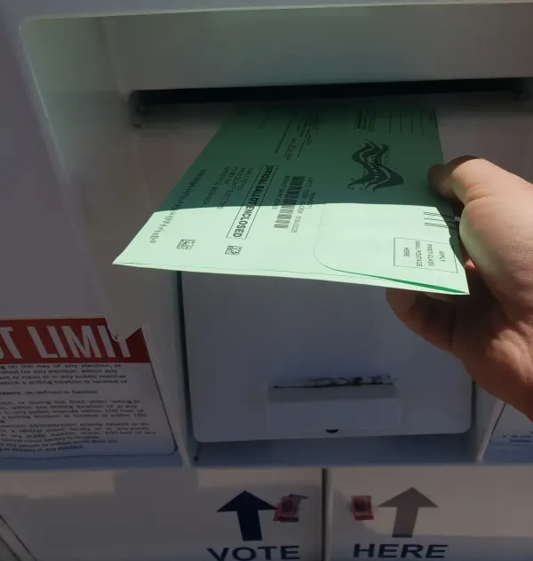 An image of me dropping off my ballot at a local dropbox