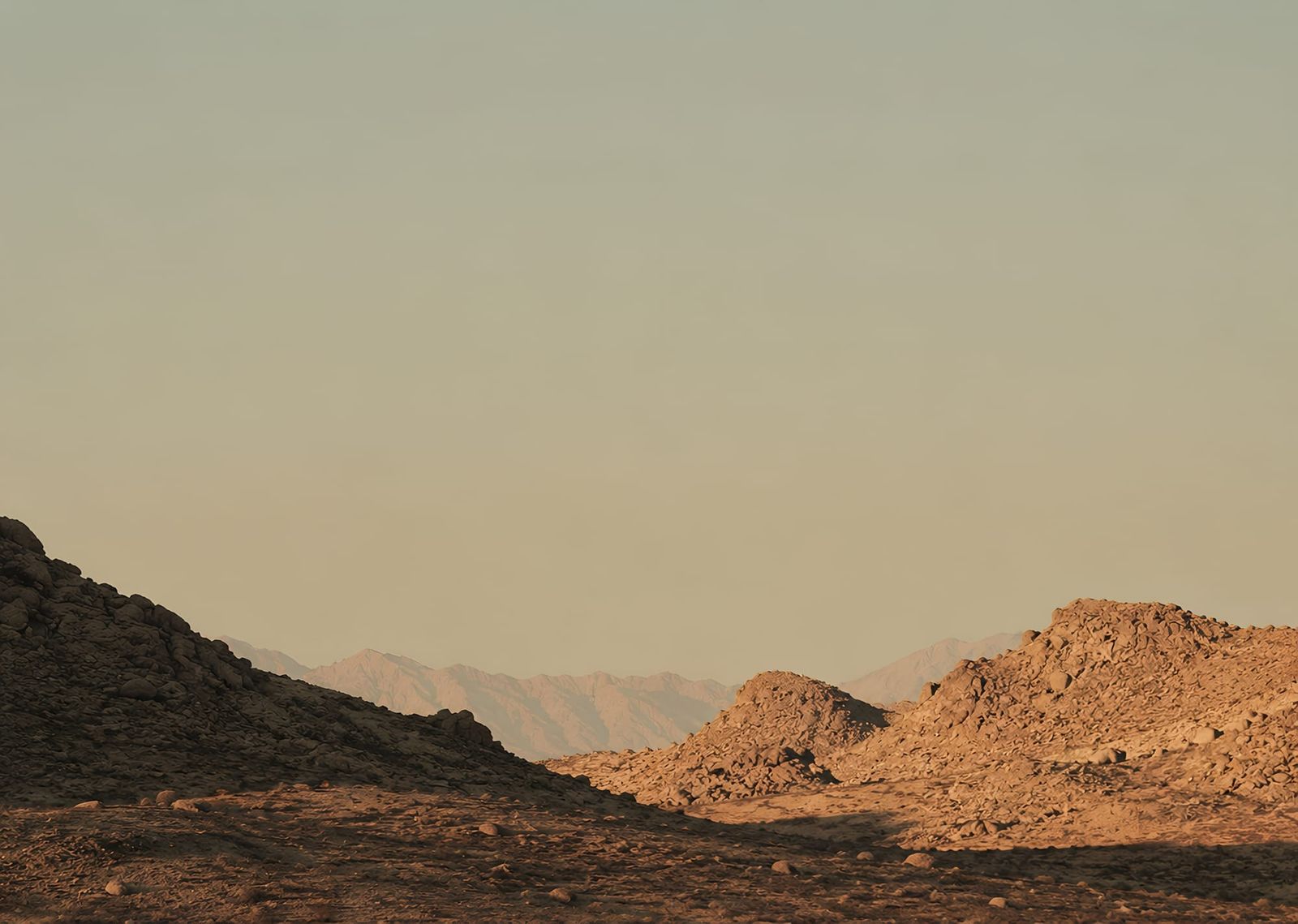 Golden Hour Desert Landscape With Rocky Hills