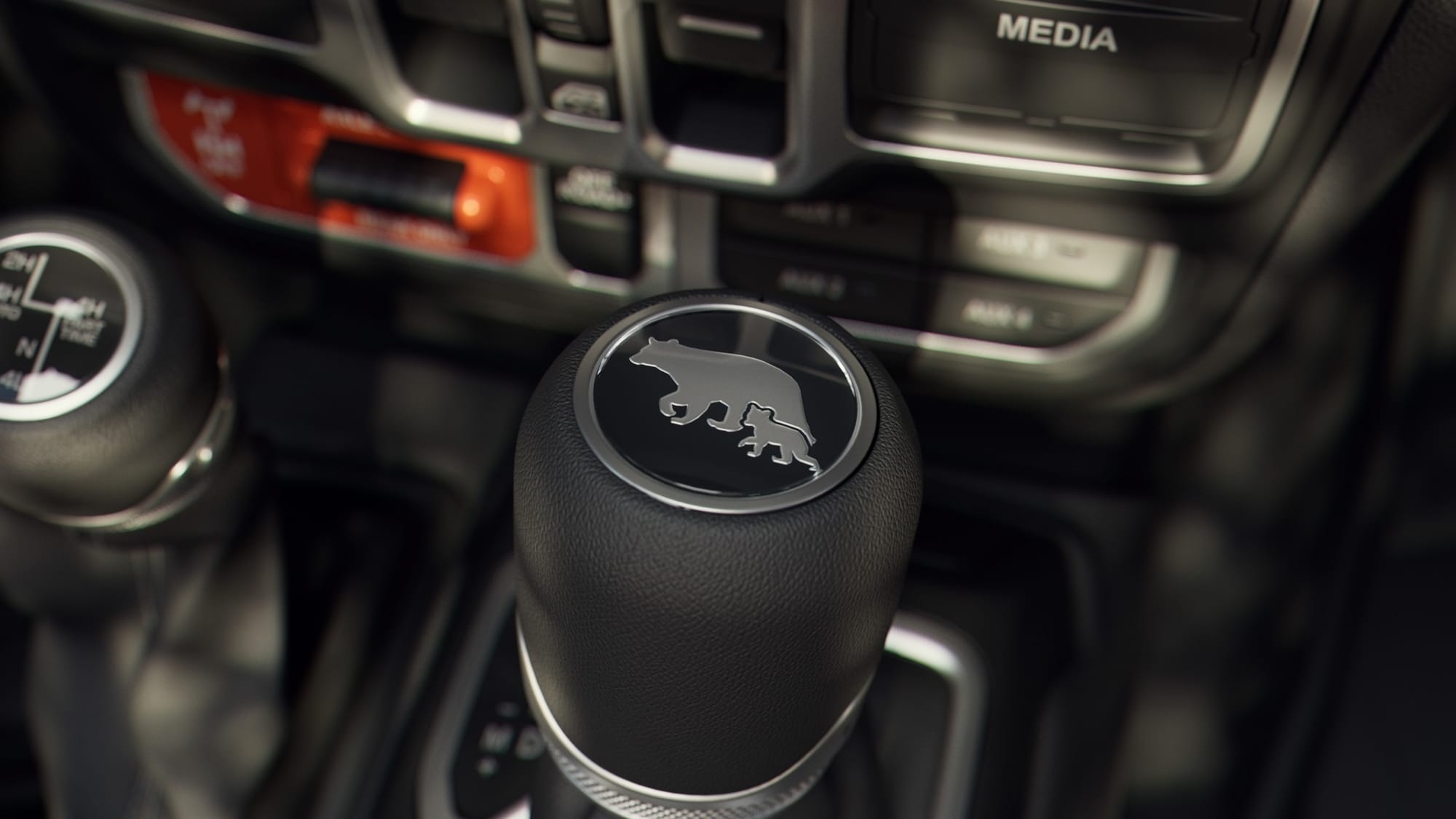 The shifter medallion on the 2027 Jeep Wrangler Smoky Mountain Edition features a mother black bear and cub motif, nodding towards the usual wildlife found in the Great Smoky Mountains.